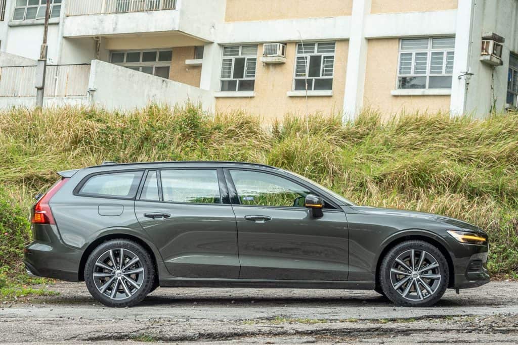 A light gray Volvo V60 photographed in the parking lot