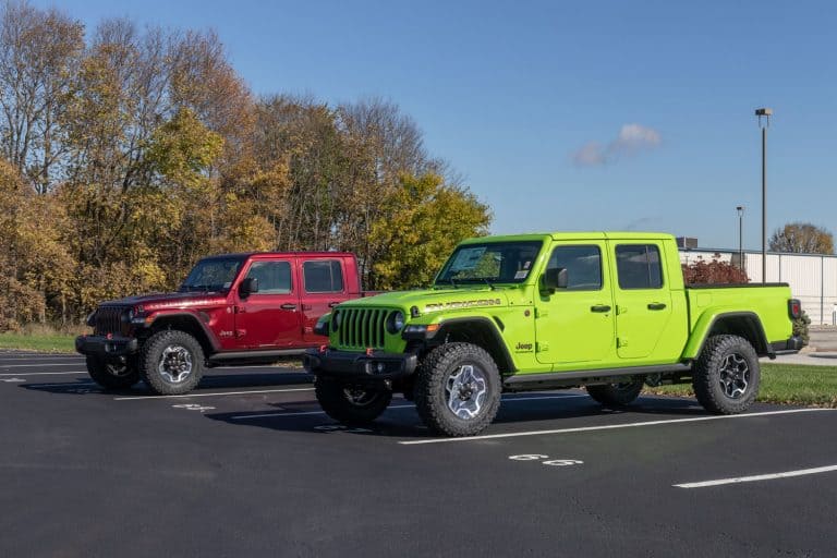 A mint green and dark red colored Jeep Gladiator photographed on the parking lot, How Much Do Jeep Gladiator Doors Weigh?