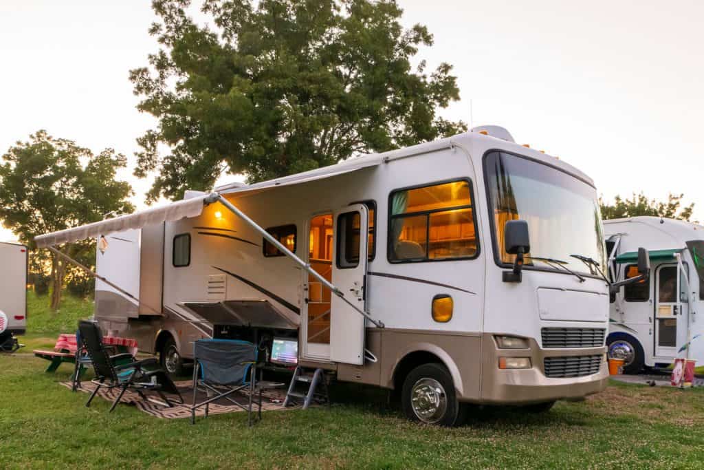 An RV parked and set up ready for camping