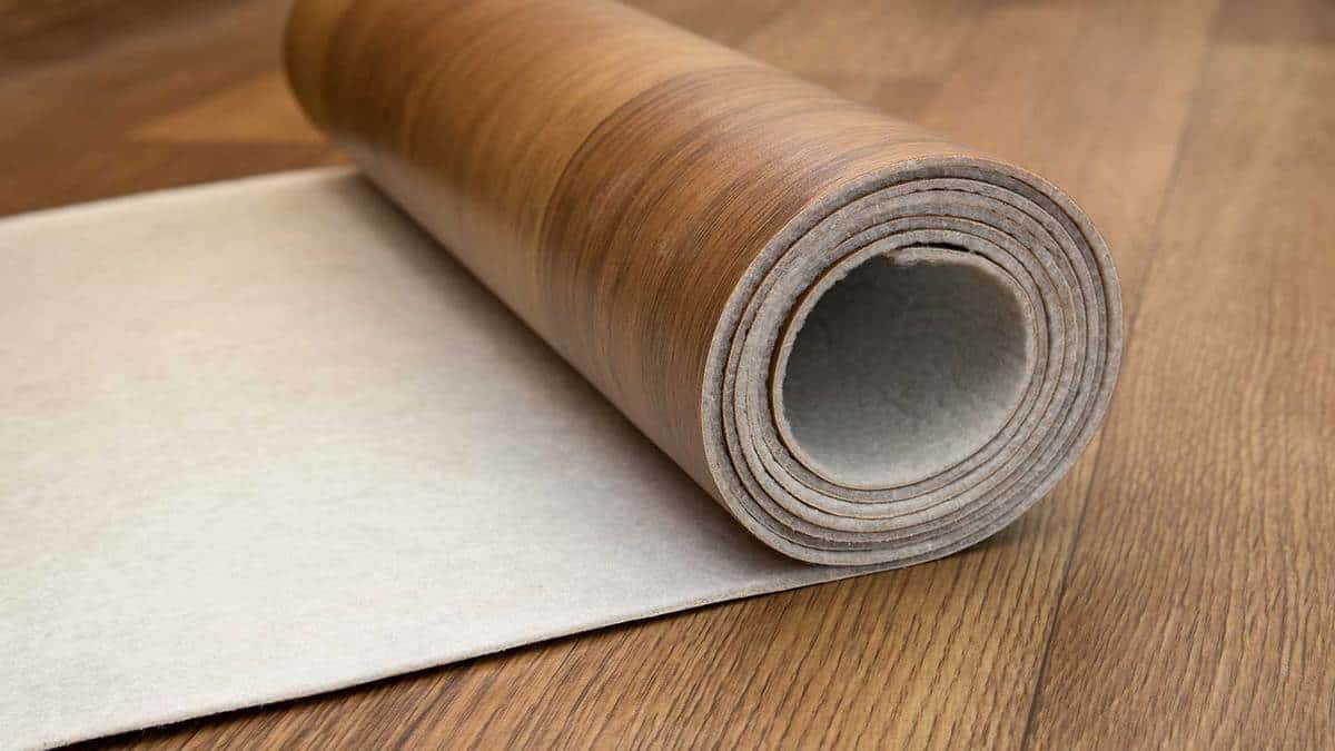 An expanded roll of brown linoleum