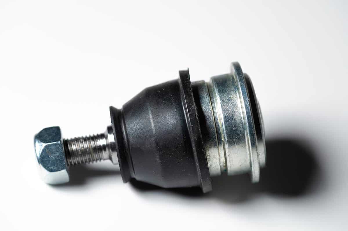 Ball joint car suspension on a gray background