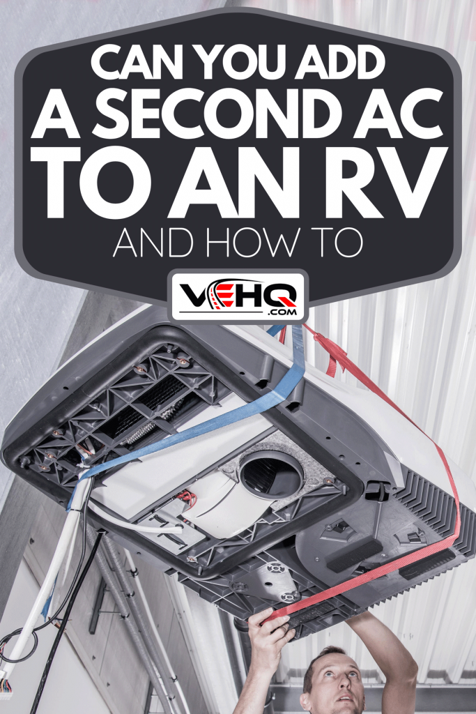 A service worker lifting heavy air conditioner unit on the motorhome roof, Can You Add A Second AC To An RV [And How To]
