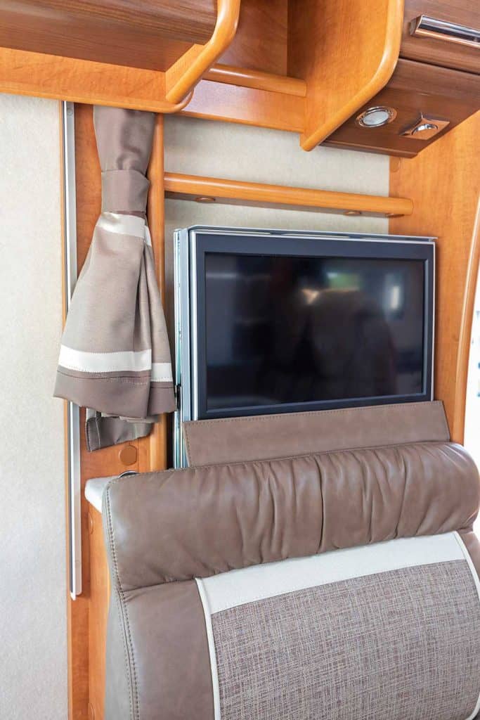 Hidden TV entertainment set in camper van
