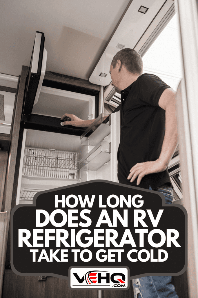A technician trying to fix the appliance inside modern recreational vehicle, How Long Does An RV Refrigerator Take To Get Cold