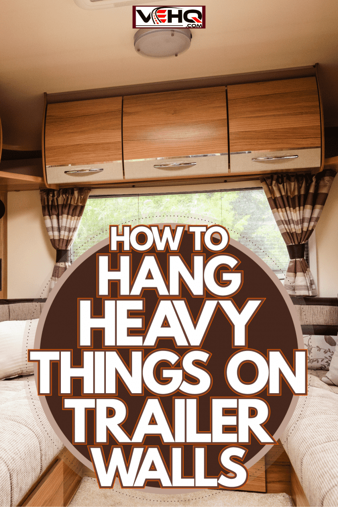 Wooden or rustic themed interior of an RV with gorgeous and comfy furniture's and brown curtains, How To Hang Heavy Things On Trailer Walls
