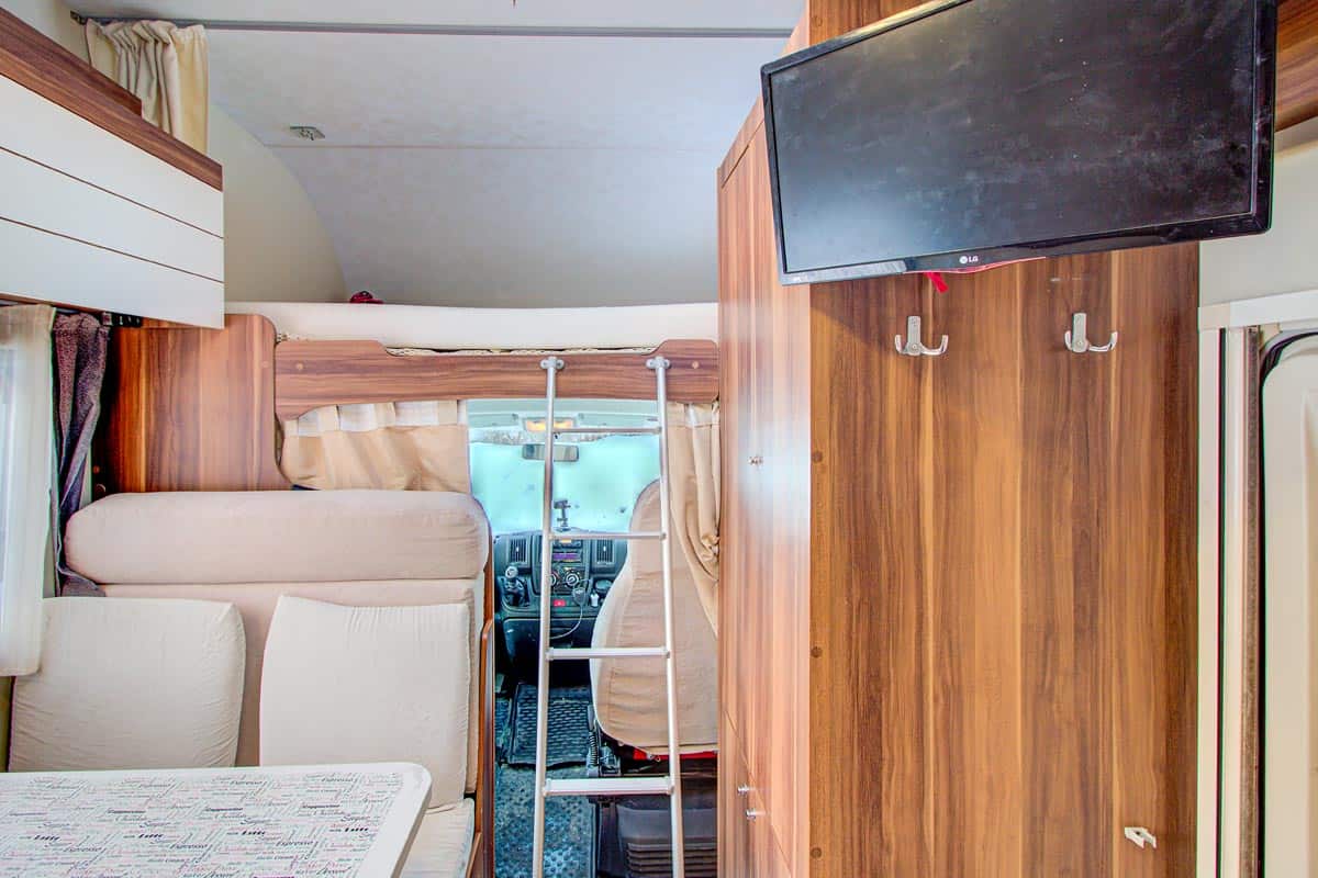 Interior of a mobile home with TV on wall, How To Mount A TV In A Camper
