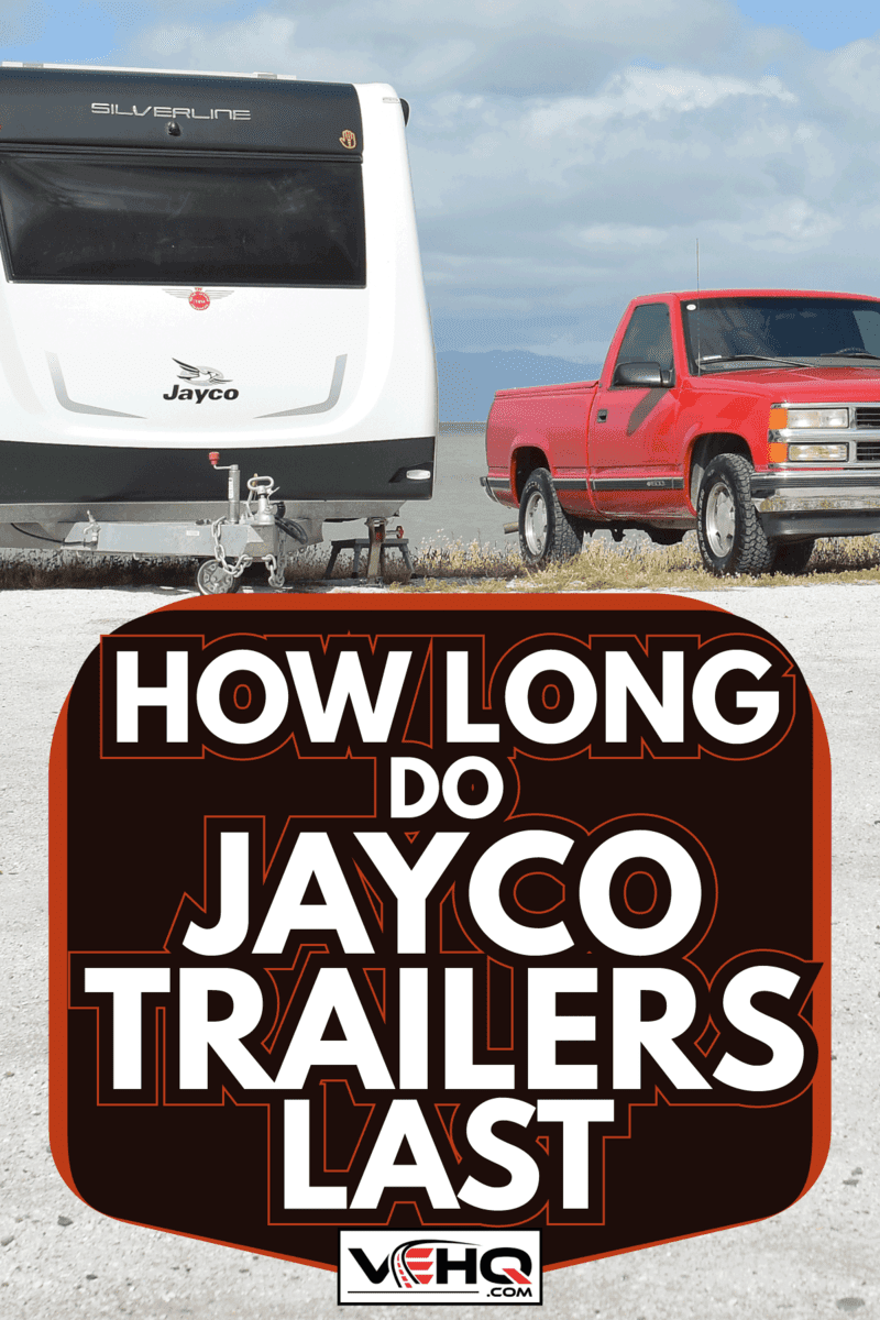 Jayco caravan beside a red pickup truck. How Long Do Jayco Trailers Last