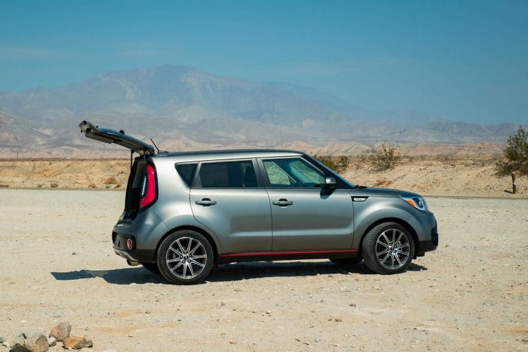 Kia Soul with hatchback open at a desert campsite, Can Kia Soul Go Off Road? [Here's What You Need to Know]