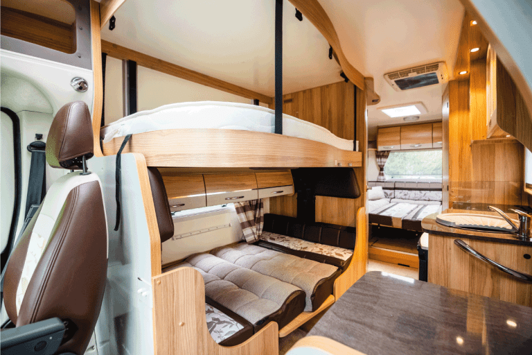 Luxury large open plan motor home interior with sleeping area for several occupants. What Size Are Bunk Beds In An RV