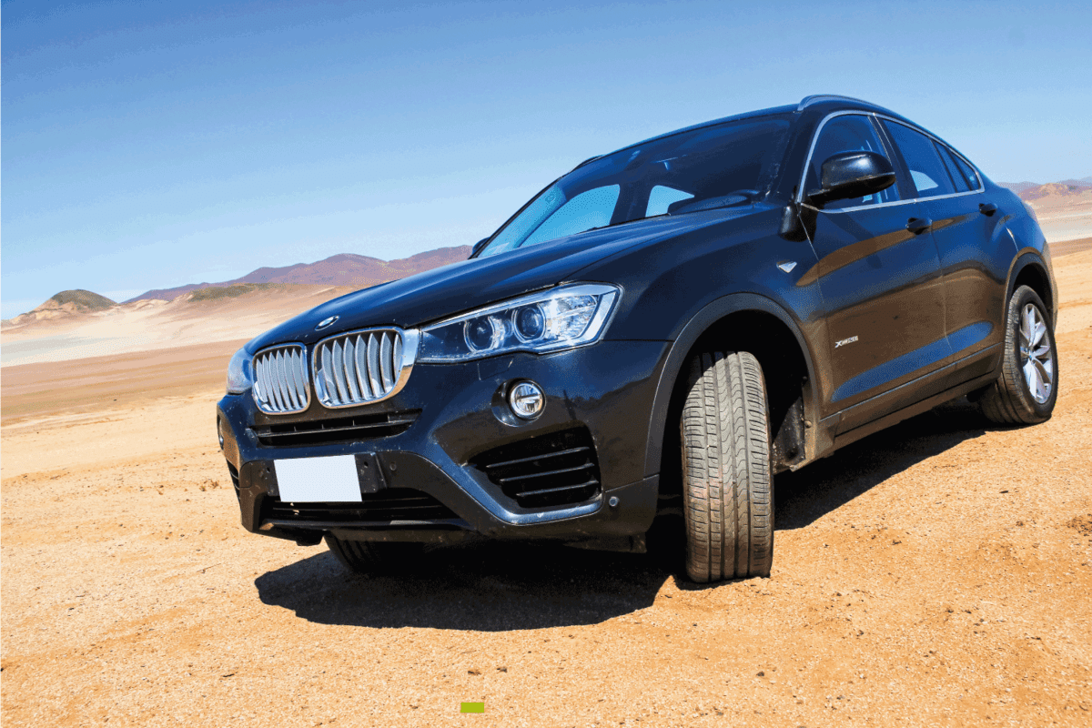 New black crossover BMW F26 X4 is parked at the Atacama desert.