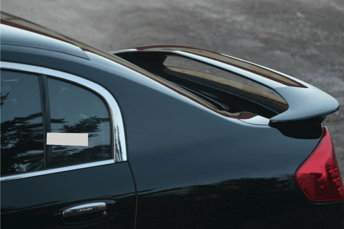 Rear deck spoiler on an executive class sports sedan