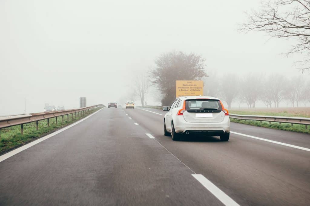 White Volvo V60 car driving on French highway