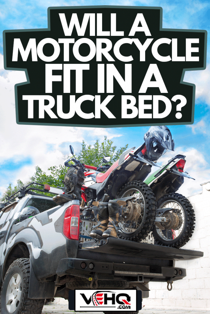 Two dirt bike motorcycles on the back of the camo truck with safety equipment, such as motorcycle boots and helmets, Will A Motorcycle Fit In A Truck Bed?