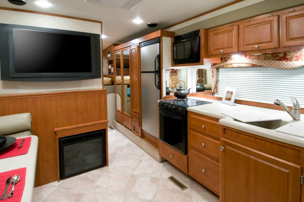 Wooden cabinets and cupboards inside a luxury motorhome