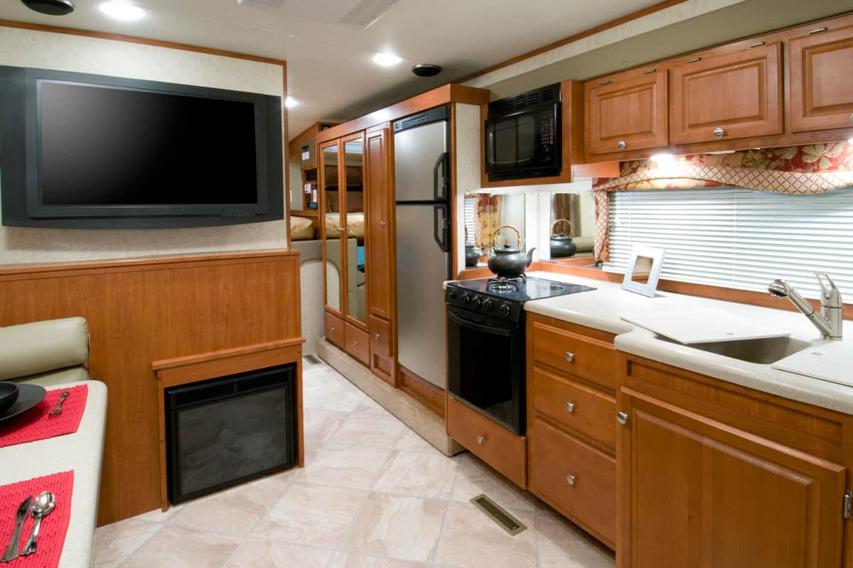 Wooden cabinets and cupboards inside a luxury motorhome, How Big Is An RV Fridge?
