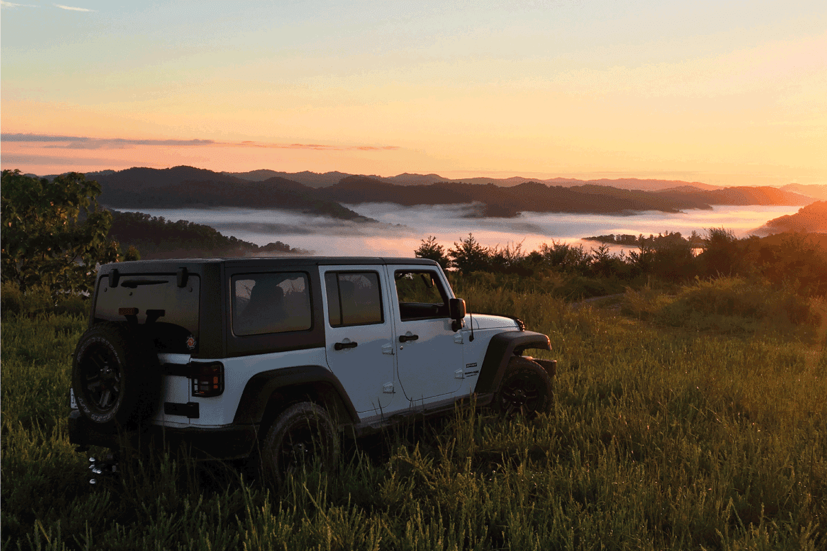 jeep wrangler infront of the sunrise on the grasslands. Jeep Wrangler Won't Start (And No Click) - What Could Be Wrong