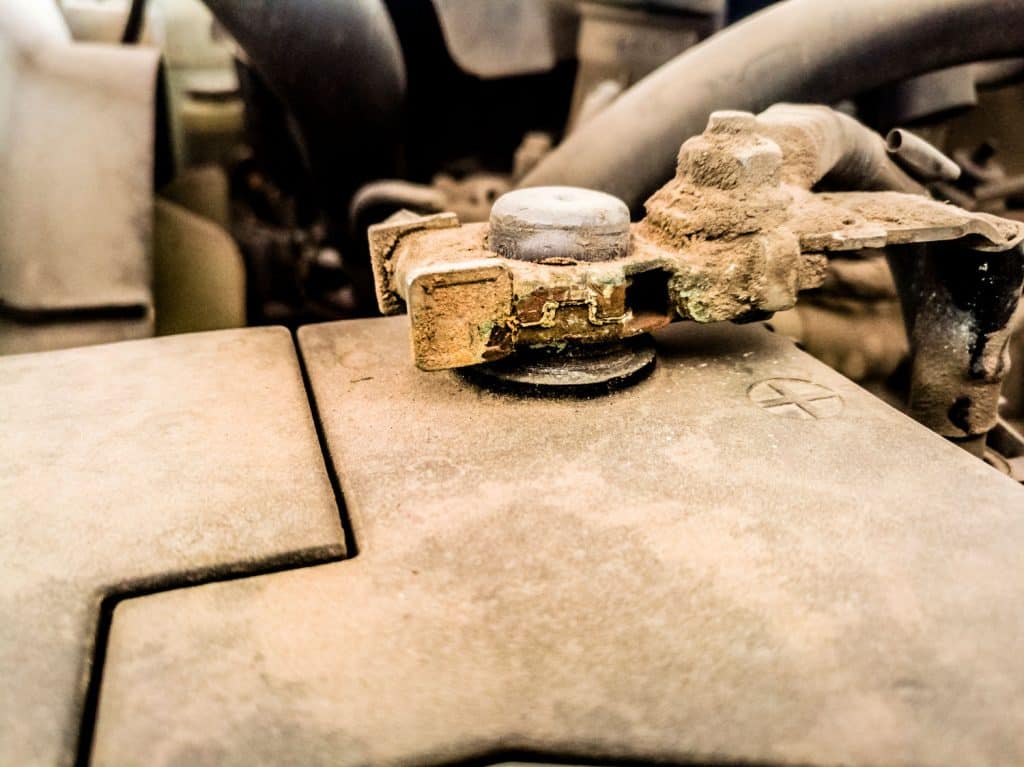 old and dusty and rusty vehicle parts at car maintenance workshop