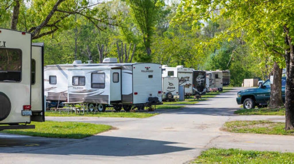 row of camping trailers in an rv park