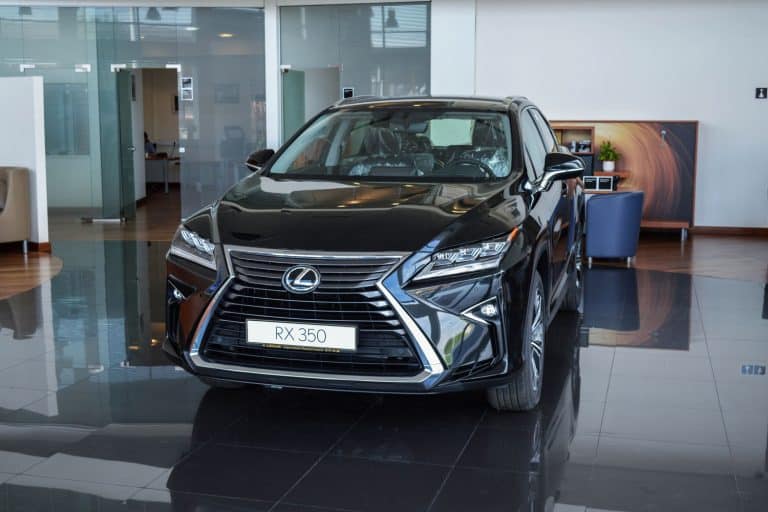 A black Lexus RX350 displayed inside the dealership, How To Fold The Mirrors On A Lexus RX 350