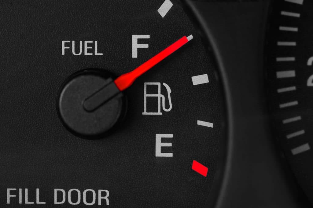 A fuel gauge showing that the fuel tank is half full