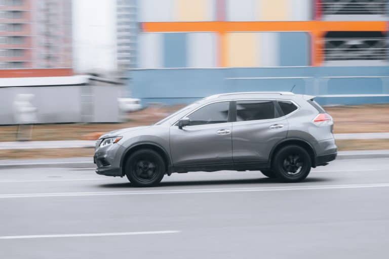A gray colored Nissan Rogue moving fast on the highway, Can A Nissan Rogue Be Flat Towed