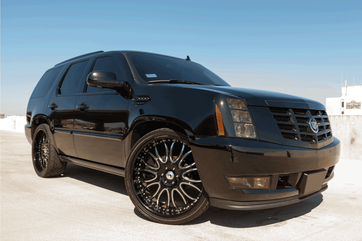 A photo of a black parked Cadillac Escalade, the Escalade from Cadillac is their most popular SUV