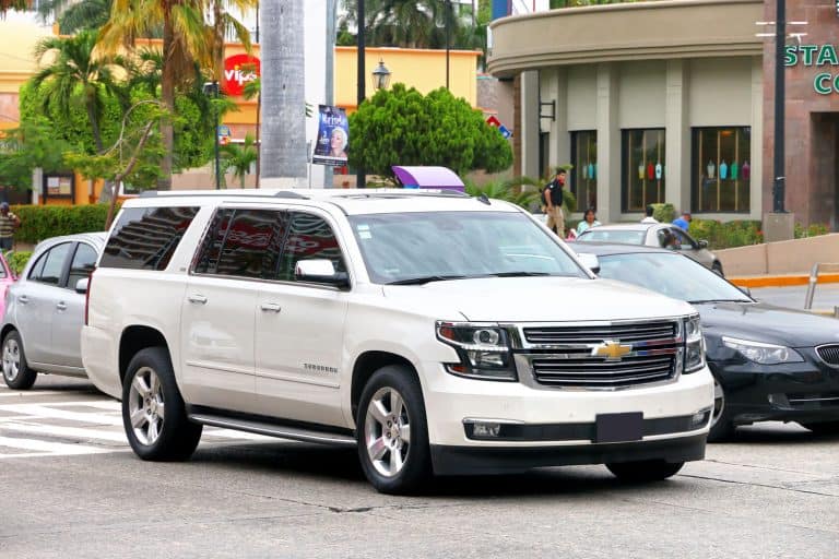 A white Chevrolet Suburban moving along the highway, Chevy Suburban Won't Shift Gears - What Could Be Wrong?
