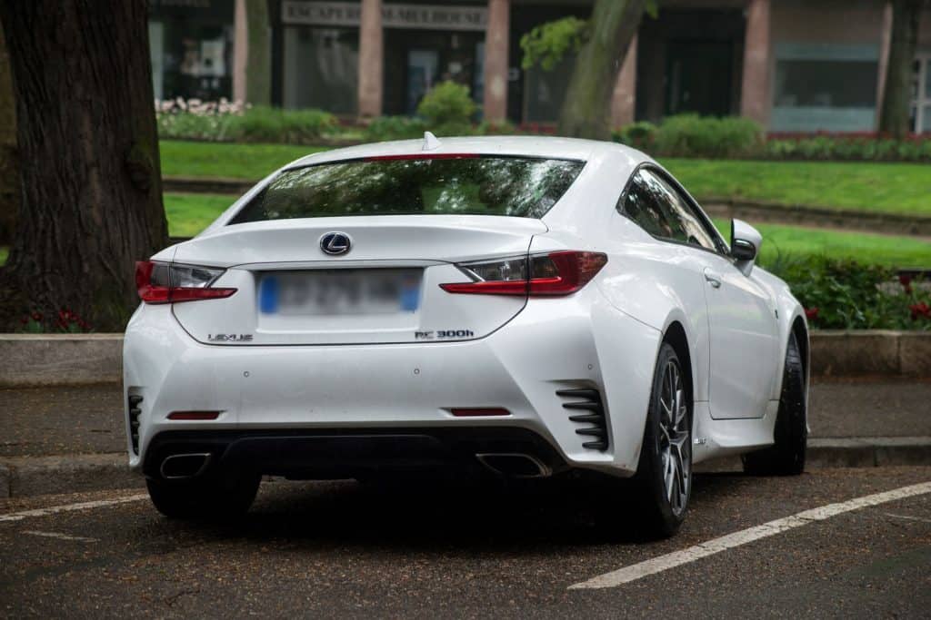 A white Lexus RC300h photographed on the parking lot