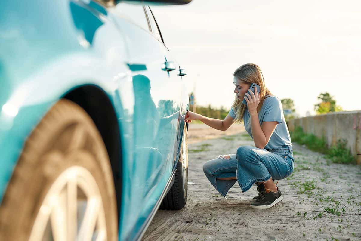 Attractive young woman looking calling car service
