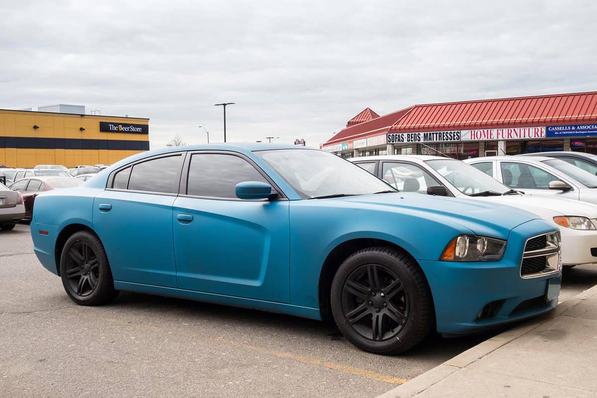 Blue colored seventh generation Dodge Charger parked in a parking lot