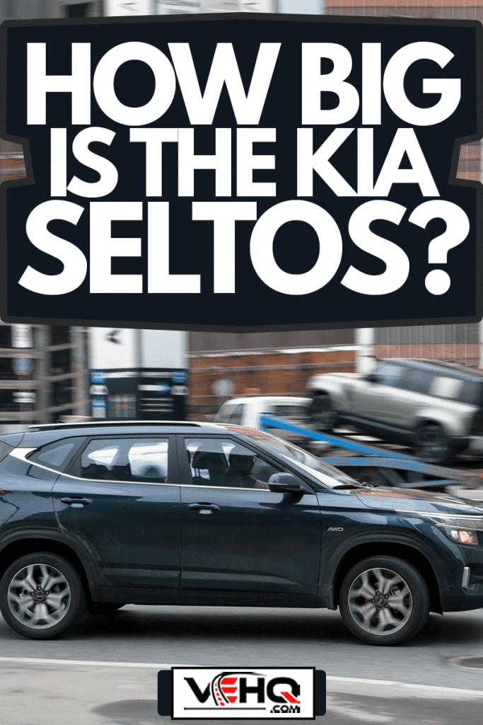 fast moving blue Kia Seltos SUV rides on a city road, How Big is the Kia Seltos?