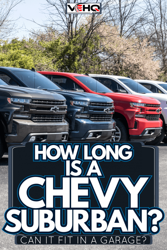 A line up of different trim levels of Chevrolet Suburban's and Silverado's at a dealership, How Long Is A Chevy Suburban? [Can It Fit In A Garage?]