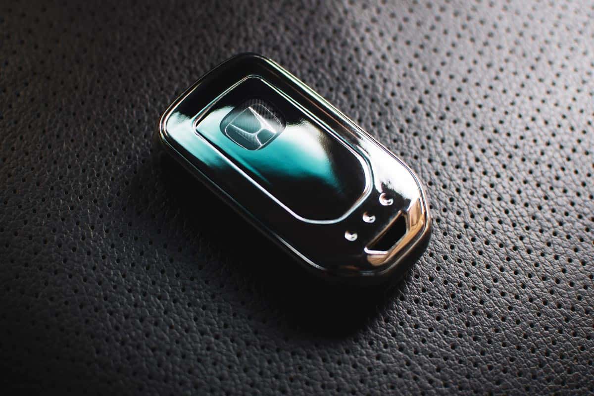 Keyless remote on leather seat of Honda Accord Generation 9, How To Program A Honda Accord Key Chip