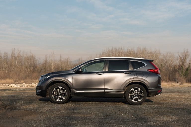 New Honda CR-V 4x4 in grey colour in nature with blue sky in background, How To Fold The Back Seat Of A Honda CR-V