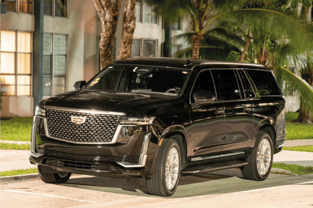 Night photo of a Cadillac Escalade luxury suv limo used for Uber and Lyft