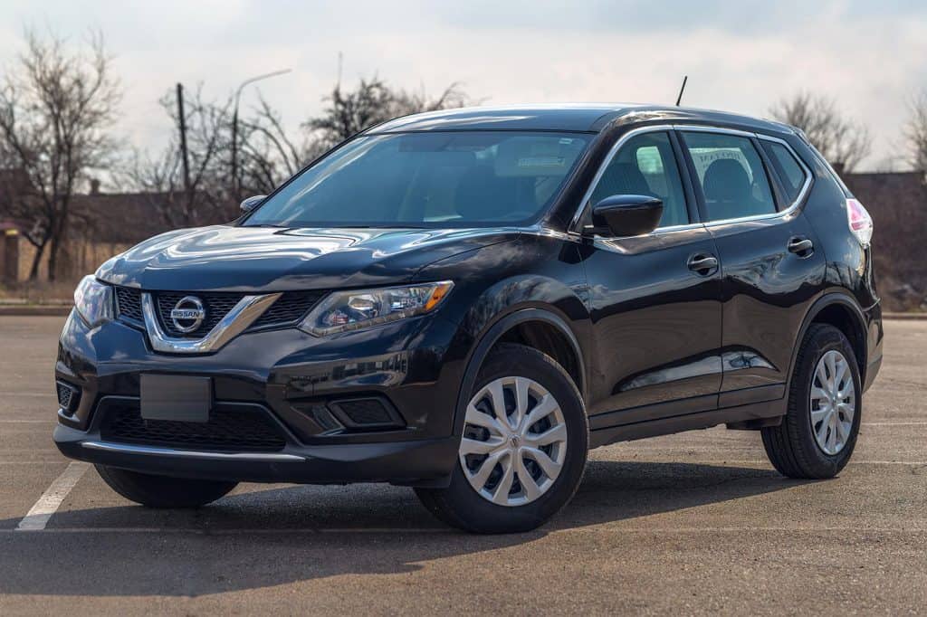 Photo of black Nissan Rogue in the open air