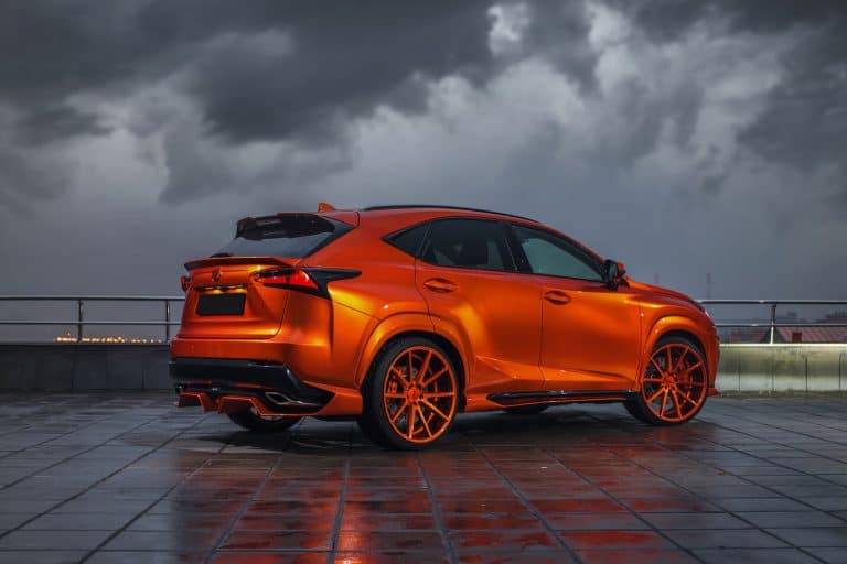 fire color Lexus NX 300h on big Vossen wheels parked in evening cloudy day, Lexus NX Won't Start - What Could Be Wrong?