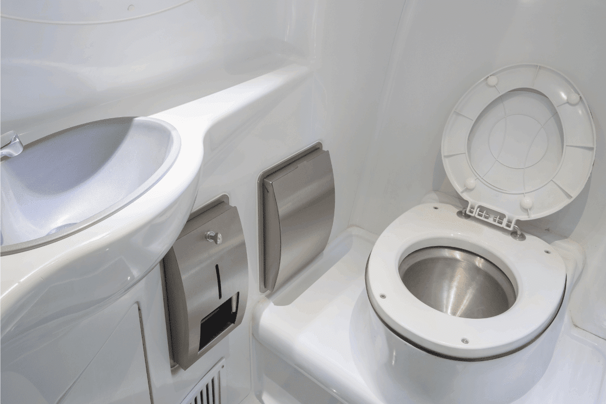luxury white and stainless steel comfort room of a camper van. How To Turn Off The Water To RV Toilet