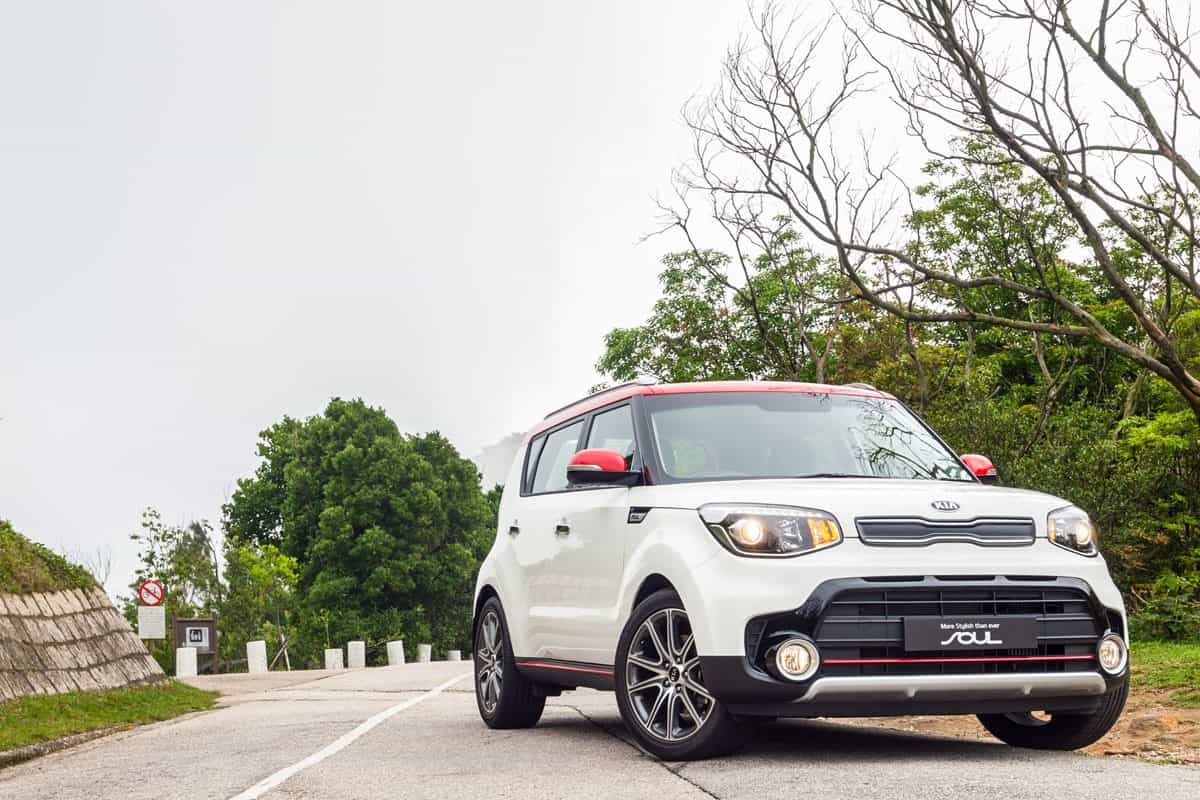 newly release white glossy Kia Soul on the road park