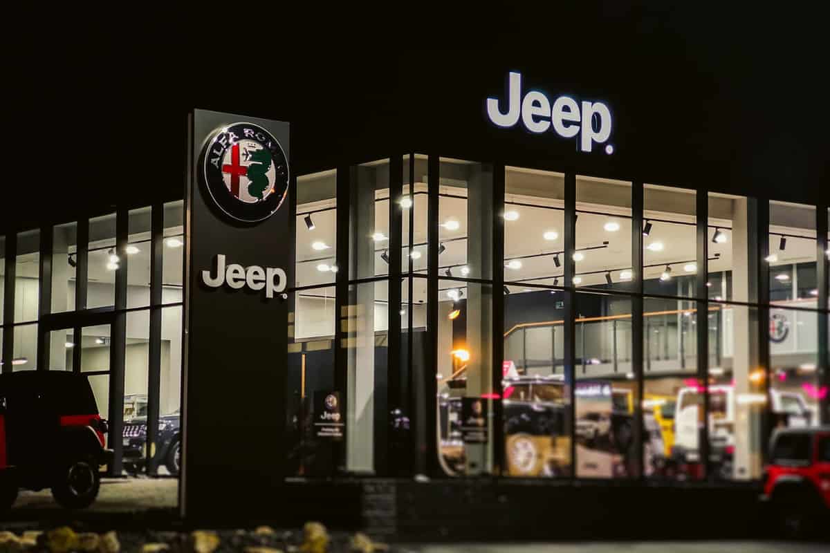 A Jeep dealership photographed at night