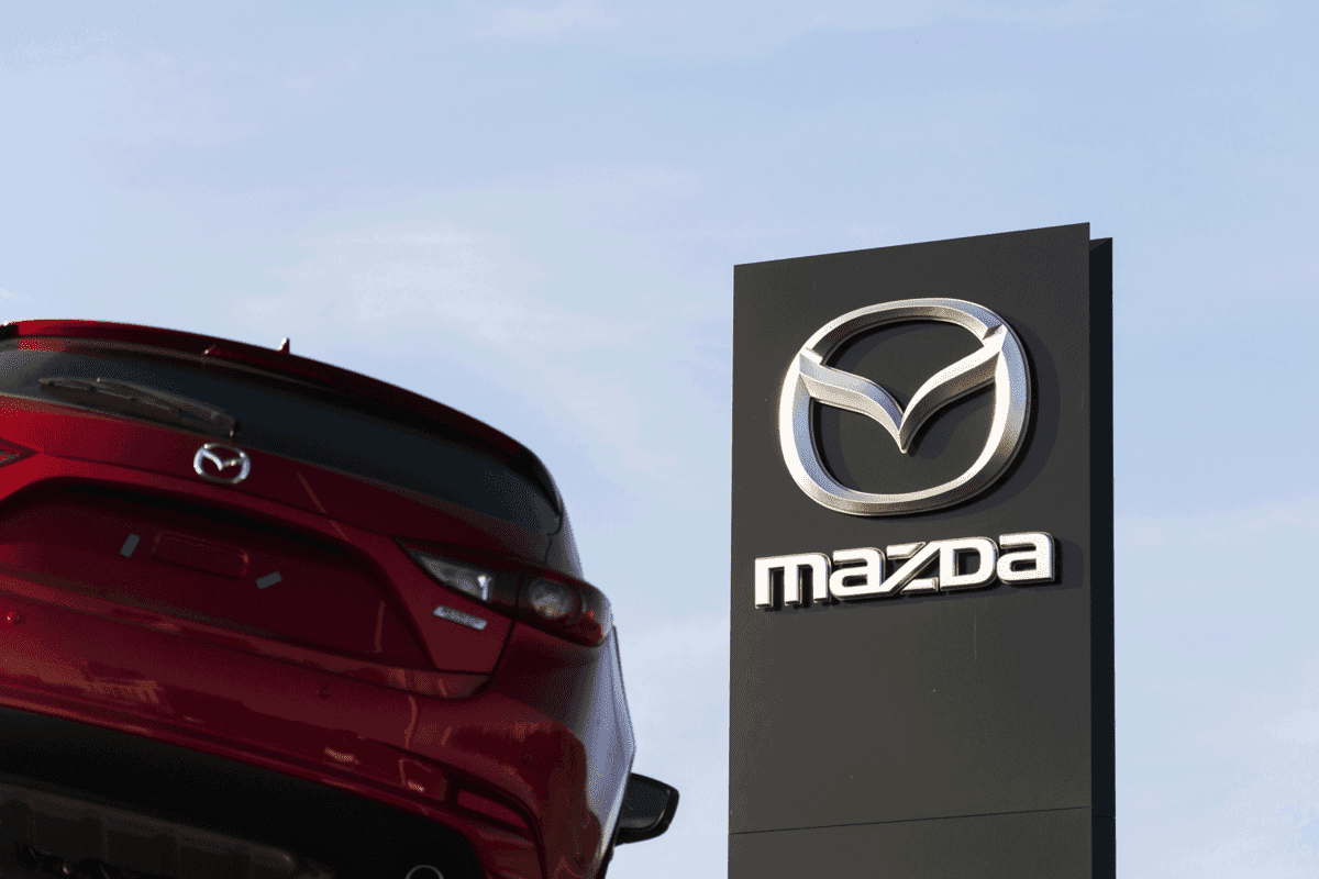 A Mazda 3 displayed at a Mazda dealership