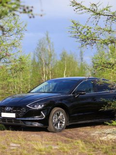 A black Hyundai Sonata parked on a small foresty area, Can A Hyundai Sonata Pull A Trailer?