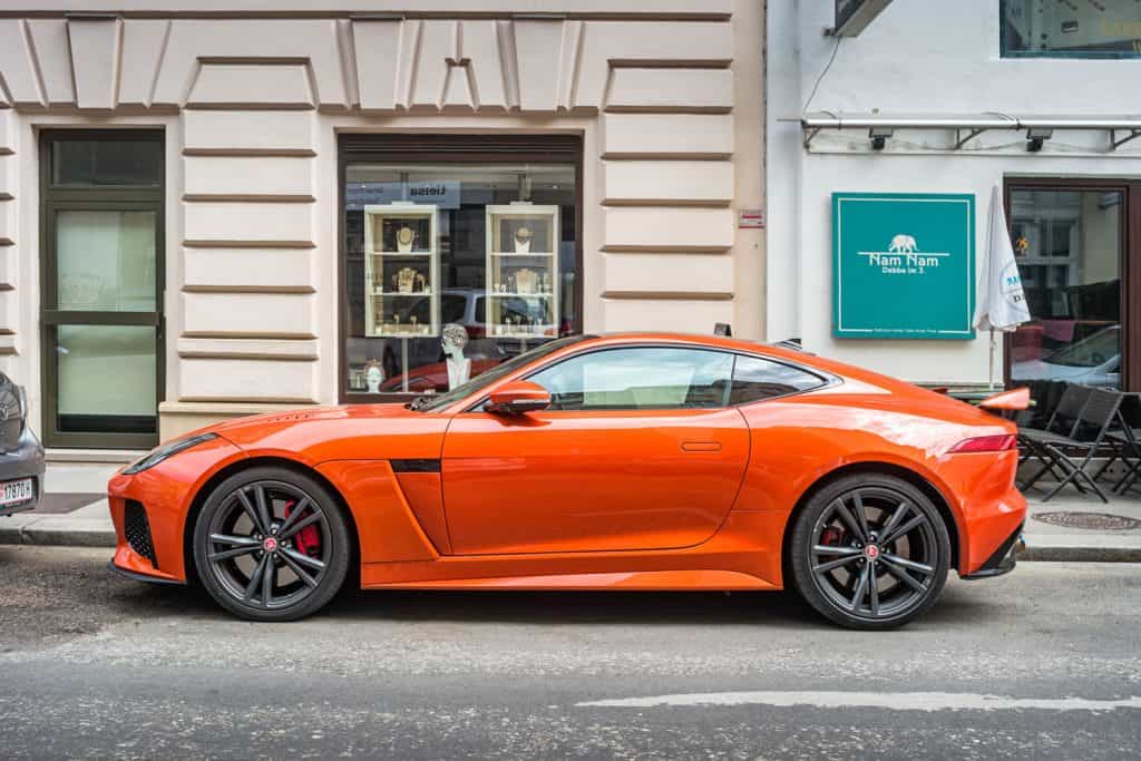 A dark orange colored Jaguar F-type SVR
