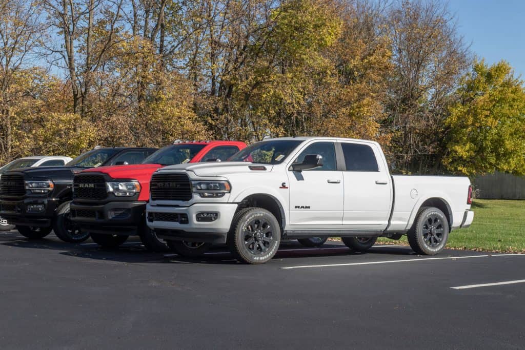 A line up of 2021 Ram 2500s at a dealership