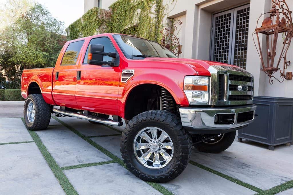 A parked red 2008 Ford F250 truck