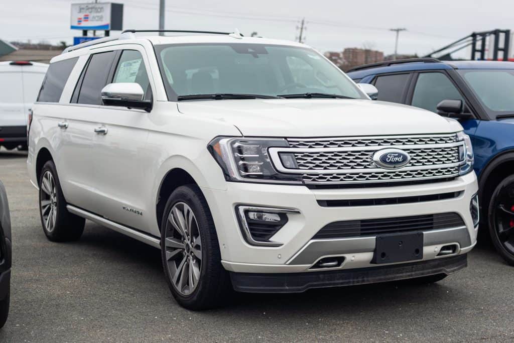 A white Ford Expedition at a dealership