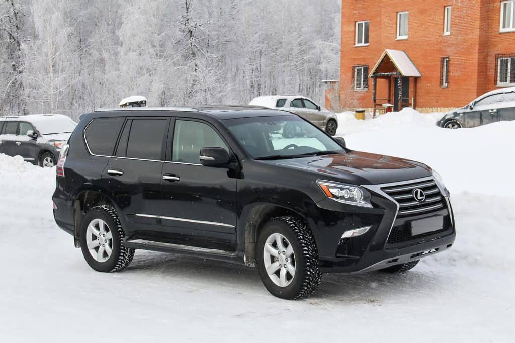 Black luxury offroad vehicle Lexus GX460 at the countryside