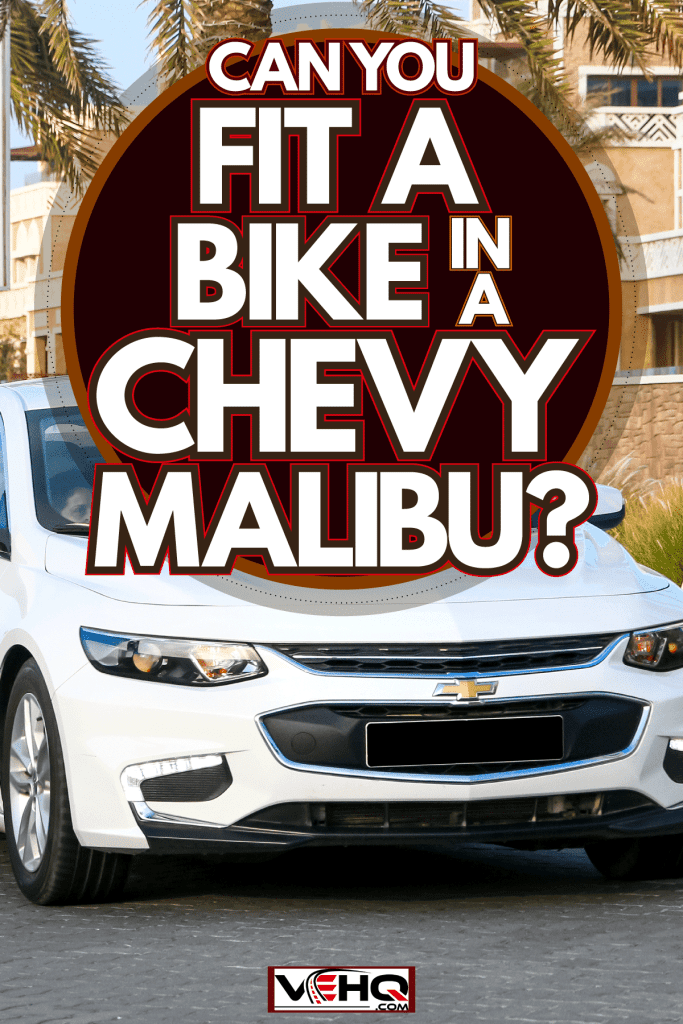 A white colored Chevy Malibu at the highway, Can You Fit A Bike In A Chevy Malibu?
