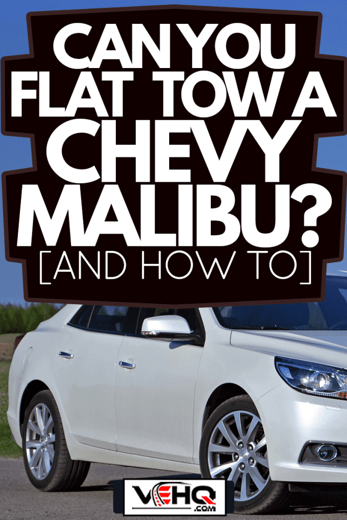 Chevrolet Malibu stopped on the road, Can You Flat Tow A Chevy Malibu? [And How To]