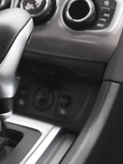 A detail of an automatic gear shifter in a new modern car, How To Put A Mazda In Neutral When The Battery Is Dead?